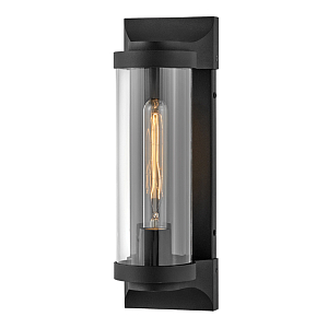 Настенный фонарь в индустриальном стиле с вытянутым цилиндрическим плафоном из прозрачного стекла и черным корпусом Hinkley